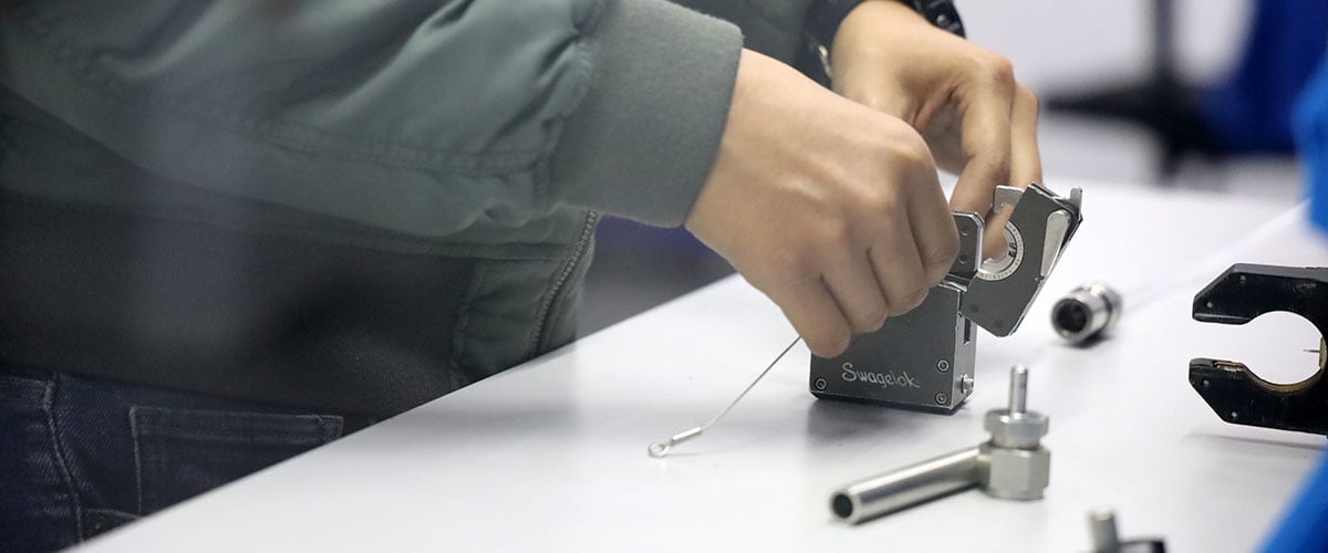 Swagelok employee working with orbital welding equipment